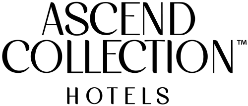 A black silhouette of a camera with a lens on a plain black background, minimal and mysterious. logo on footer section.